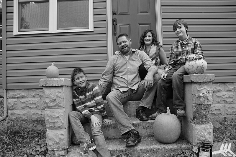 happy family in front of a door
