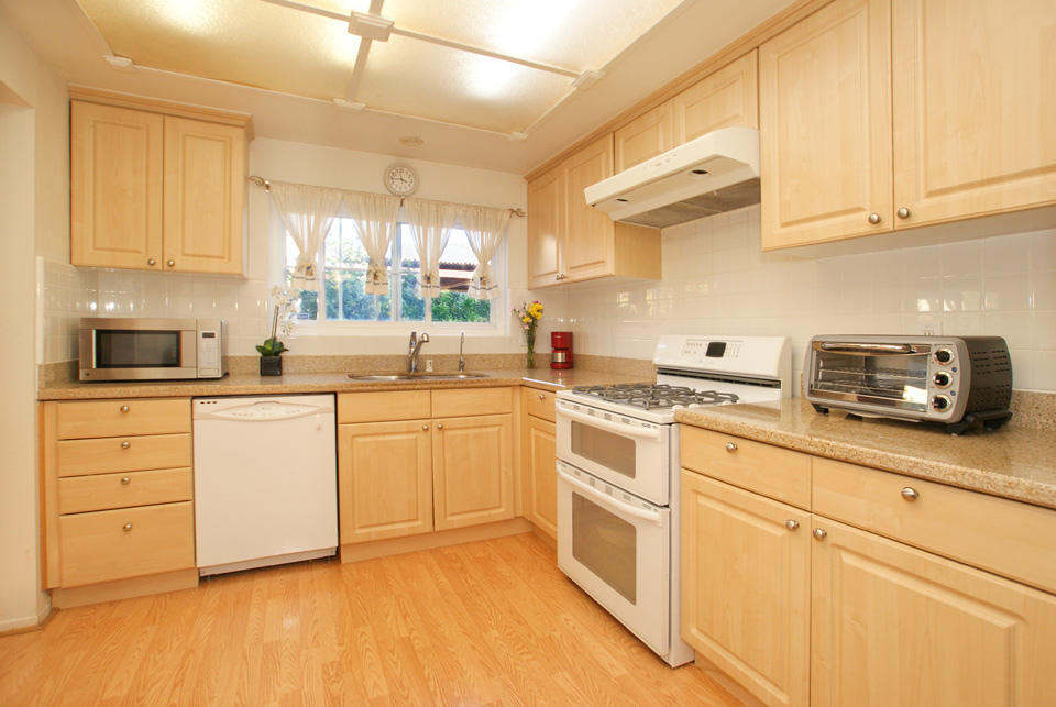 empty kitchen with some appliances 
