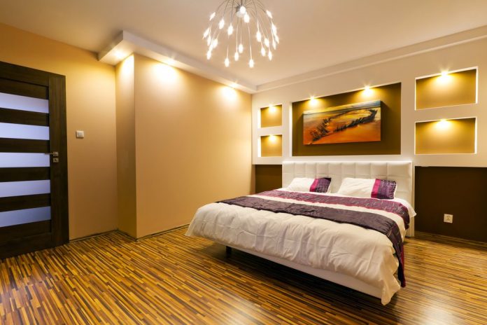 room with large bed and semi dark lighting