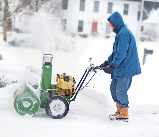 man using the snow blower