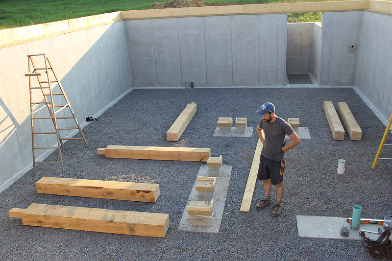 man standing thinking When a new home is being built, the question of what is the best foundation for a house will be answered by the homebuilder in consultation with the architect and homeowner.