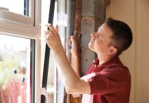 What Is the Best Lubricant for Vinyl Windows? man in window