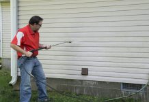 man using a pressure washer