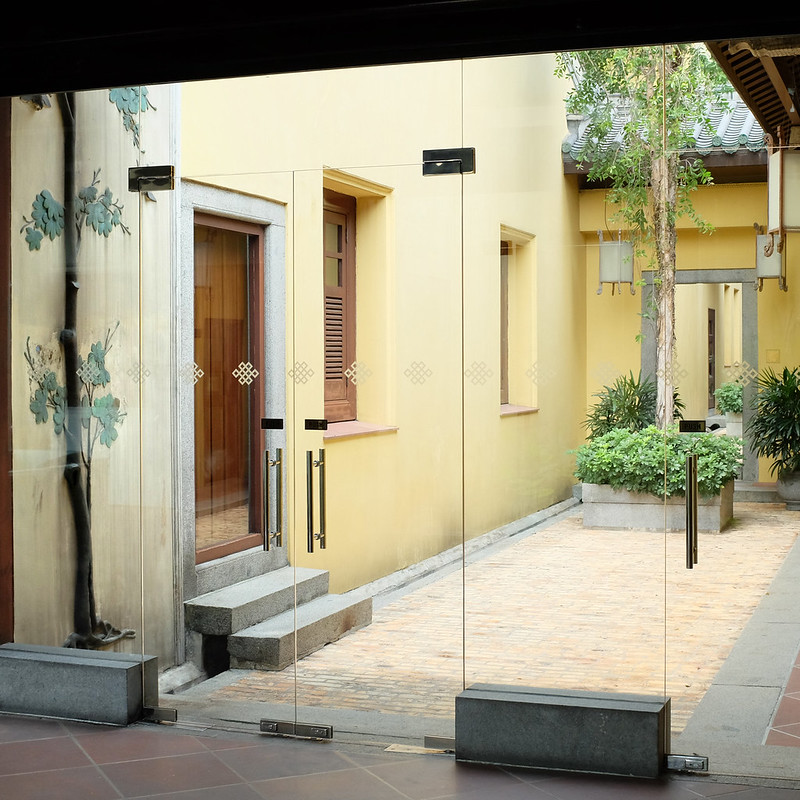 tan house with wooden door
